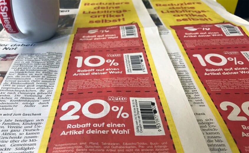 Geld sparen durch Coupons und Gutscheine